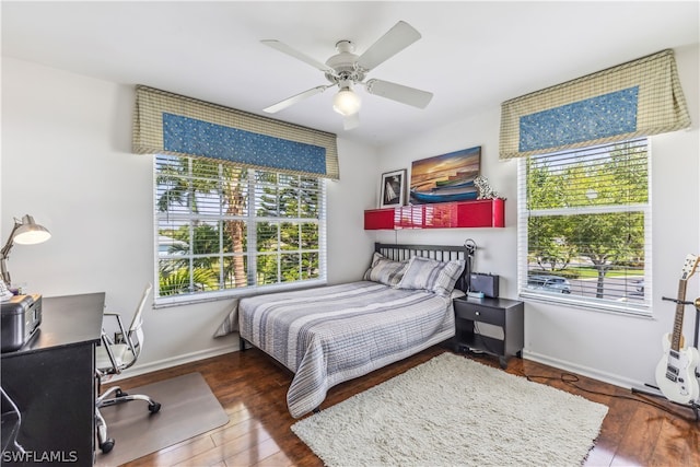 bedroom featuring ceiling fan and dark wood-type flooring