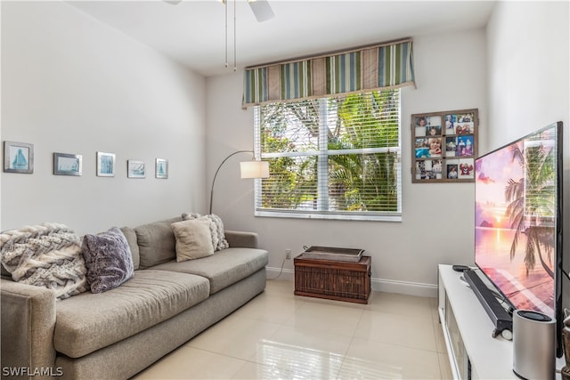 tiled living room with ceiling fan