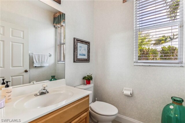 bathroom with vanity and toilet