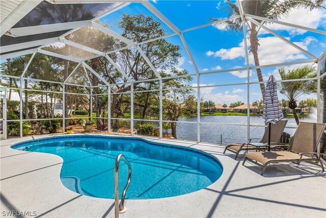 view of swimming pool with a lanai and a patio