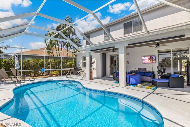 view of pool featuring a patio, a lanai, and ceiling fan