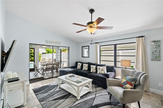 living room featuring ceiling fan and lofted ceiling