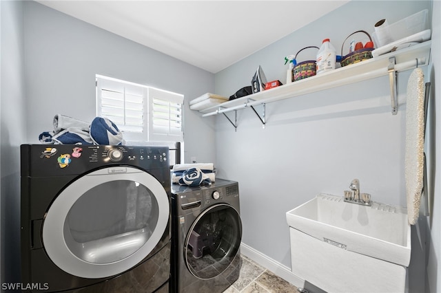 laundry room featuring sink and washing machine and dryer