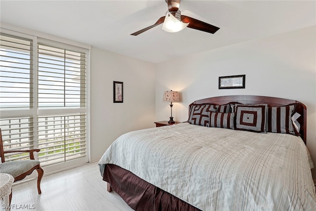 bedroom featuring ceiling fan and light hardwood / wood-style flooring