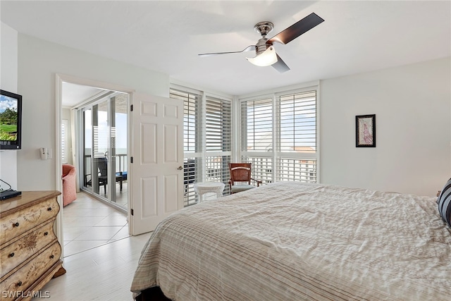 bedroom with ceiling fan, light tile floors, and multiple windows