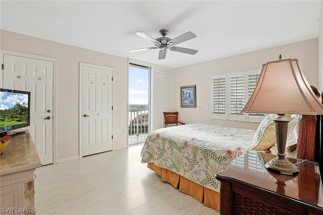 bedroom with ceiling fan, light hardwood / wood-style flooring, multiple windows, and access to outside