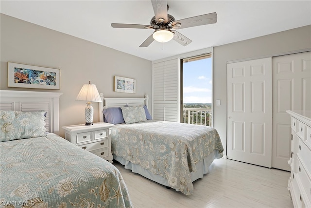 bedroom featuring a closet, access to exterior, ceiling fan, and light wood-type flooring