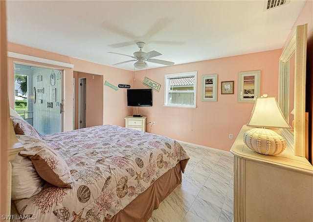 tiled bedroom with multiple windows and ceiling fan