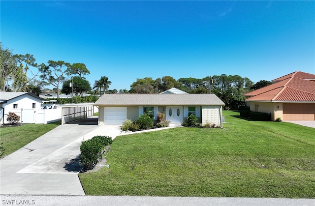 ranch-style home featuring a front lawn and a garage