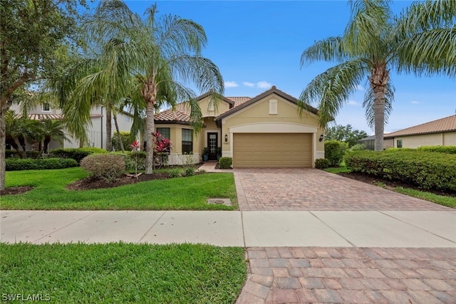 view of front of house with a front lawn and a garage