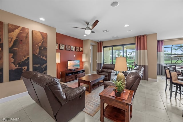 tiled living room with ceiling fan and plenty of natural light