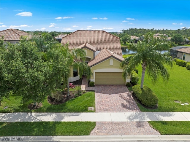 mediterranean / spanish-style house featuring a front lawn