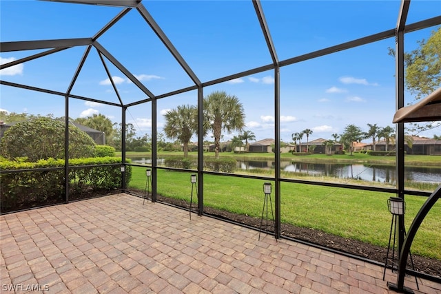 unfurnished sunroom with a water view