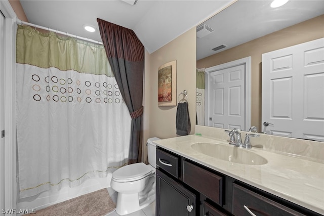 bathroom with oversized vanity and toilet