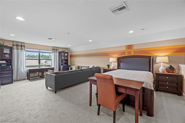 bedroom featuring light carpet