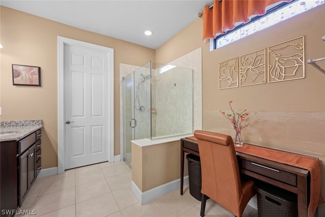 bathroom with tile flooring, an enclosed shower, and vanity