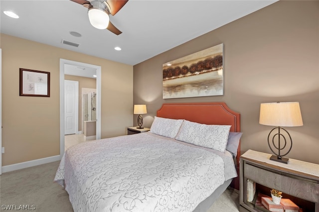 carpeted bedroom with ceiling fan and connected bathroom