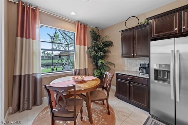 tiled dining area with a wealth of natural light