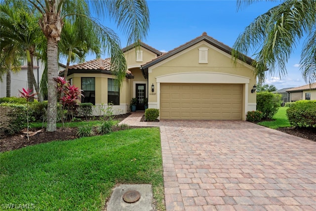 view of front facade with a front yard and a garage