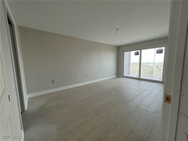 empty room with light wood-type flooring