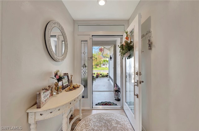 foyer entrance featuring light tile patterned flooring