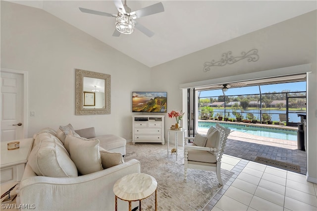 tiled living room featuring high vaulted ceiling and ceiling fan