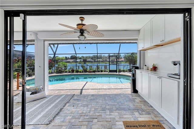 view of swimming pool featuring ceiling fan