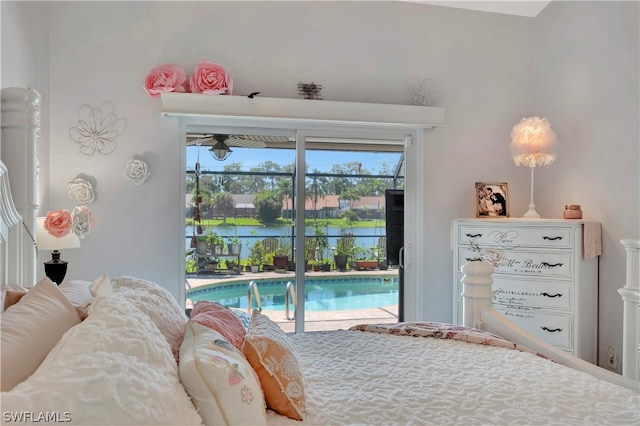 bedroom featuring access to outside and a water view