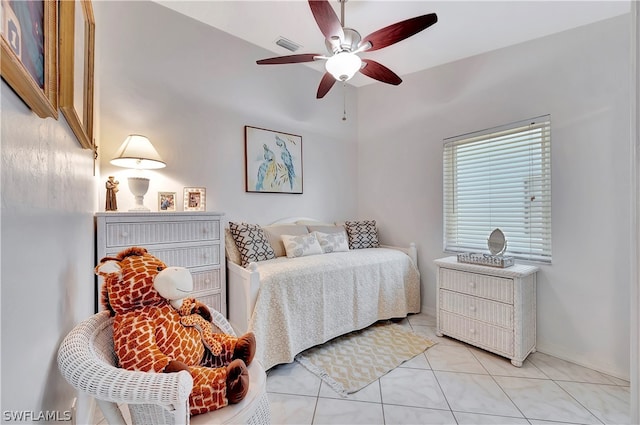 tiled bedroom with ceiling fan