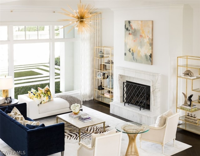 living room with ornamental molding, dark hardwood / wood-style flooring, and a fireplace