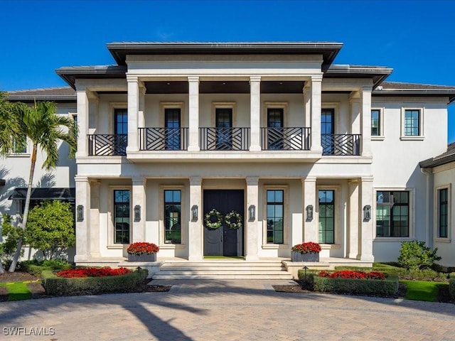 view of front of home with a balcony