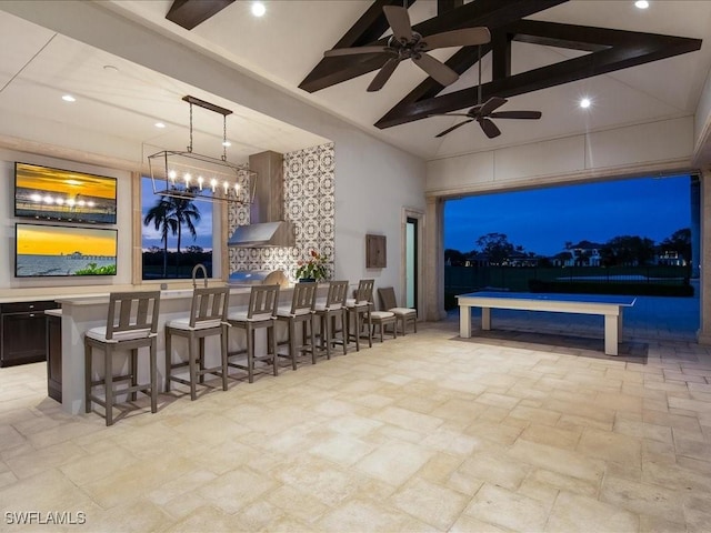 interior space featuring ceiling fan and an outdoor bar