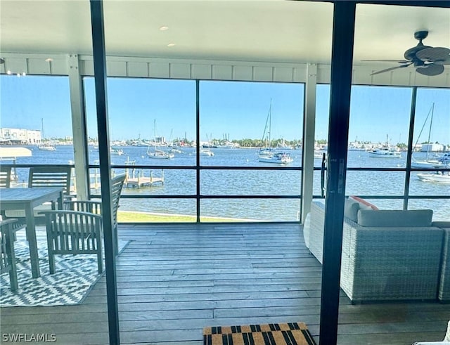 dock area featuring a water view and a balcony