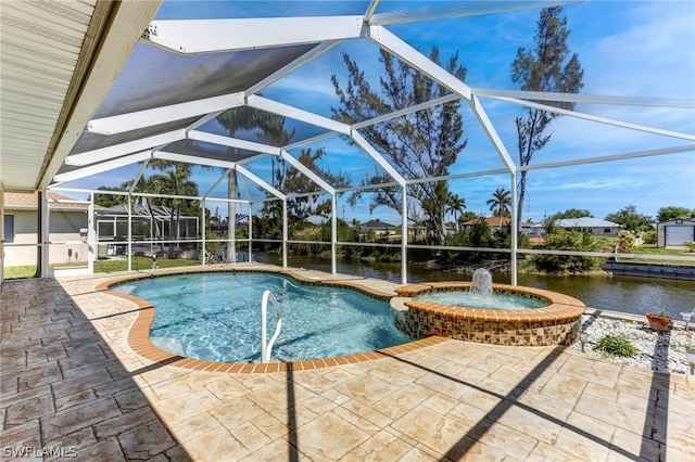 view of swimming pool featuring pool water feature, a water view, glass enclosure, and a patio area