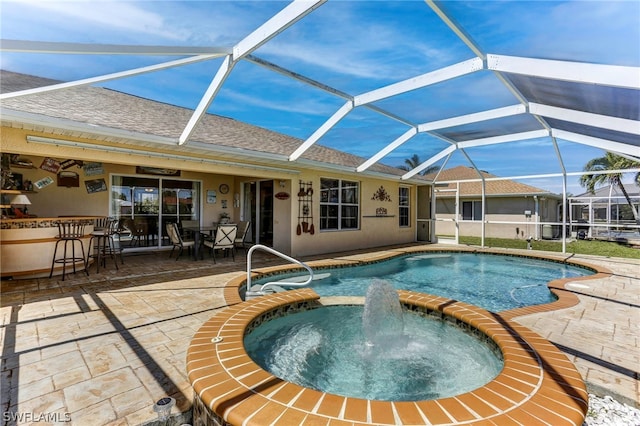 view of pool with exterior bar, an in ground hot tub, a lanai, and a patio area