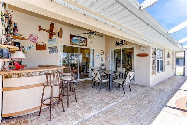 view of patio / terrace featuring an outdoor bar