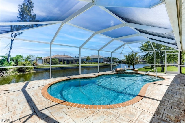 view of pool with a water view, glass enclosure, and a patio area