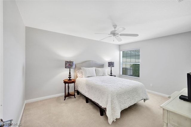 bedroom with ceiling fan and light colored carpet