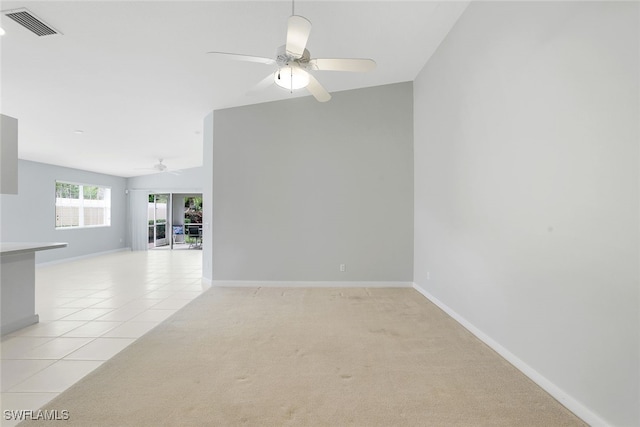 tiled empty room featuring ceiling fan