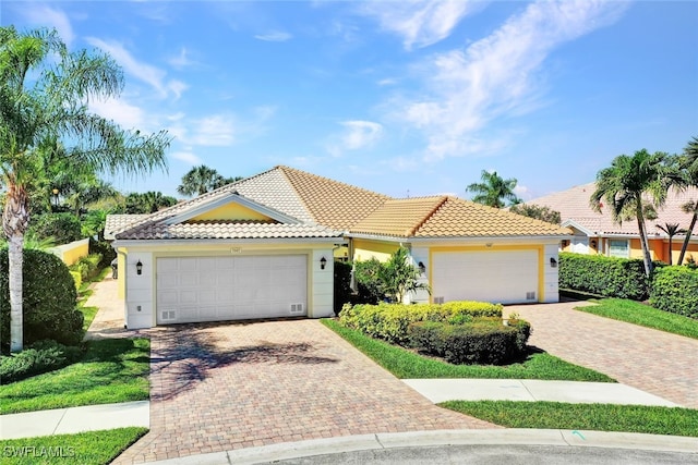 mediterranean / spanish-style home featuring a garage