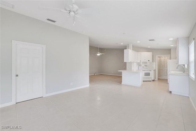 unfurnished living room with ceiling fan and light tile patterned flooring