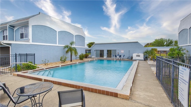 view of swimming pool featuring a patio area