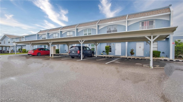 exterior space featuring a carport