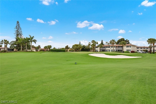 view of home's community featuring a lawn