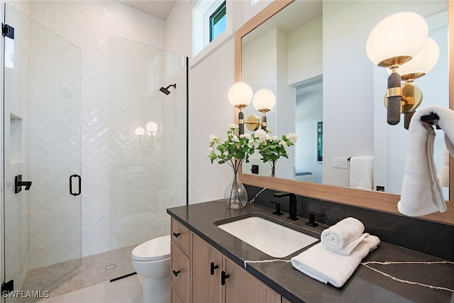 bathroom with toilet, an enclosed shower, and vanity