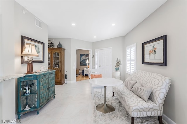 living area featuring light tile floors