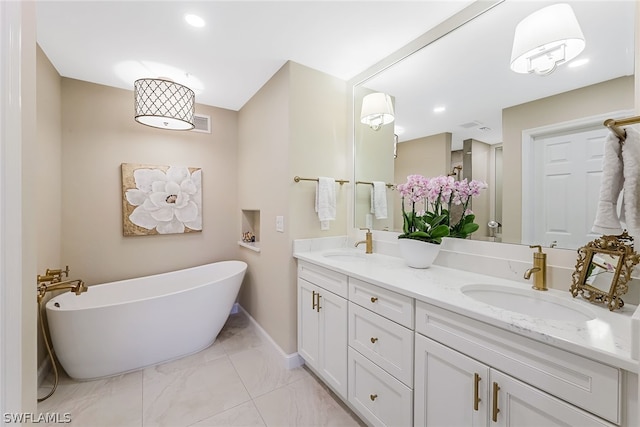 bathroom with tile floors, vanity with extensive cabinet space, double sink, and a bath