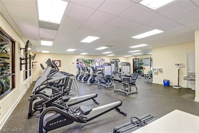 workout area with a paneled ceiling