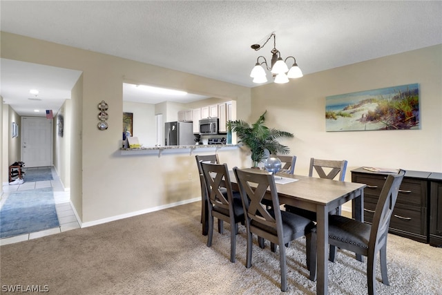 carpeted dining area with a textured ceiling and an inviting chandelier