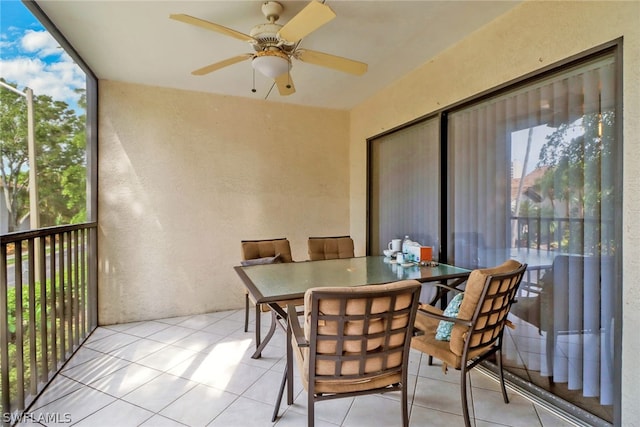 sunroom featuring ceiling fan